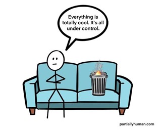 person sitting on couch next to small trash can fire saying "everything is totally cool, it's all under control"