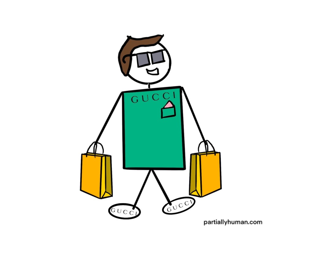 Same man holding shopping bags and wearing clothes that say Gucci